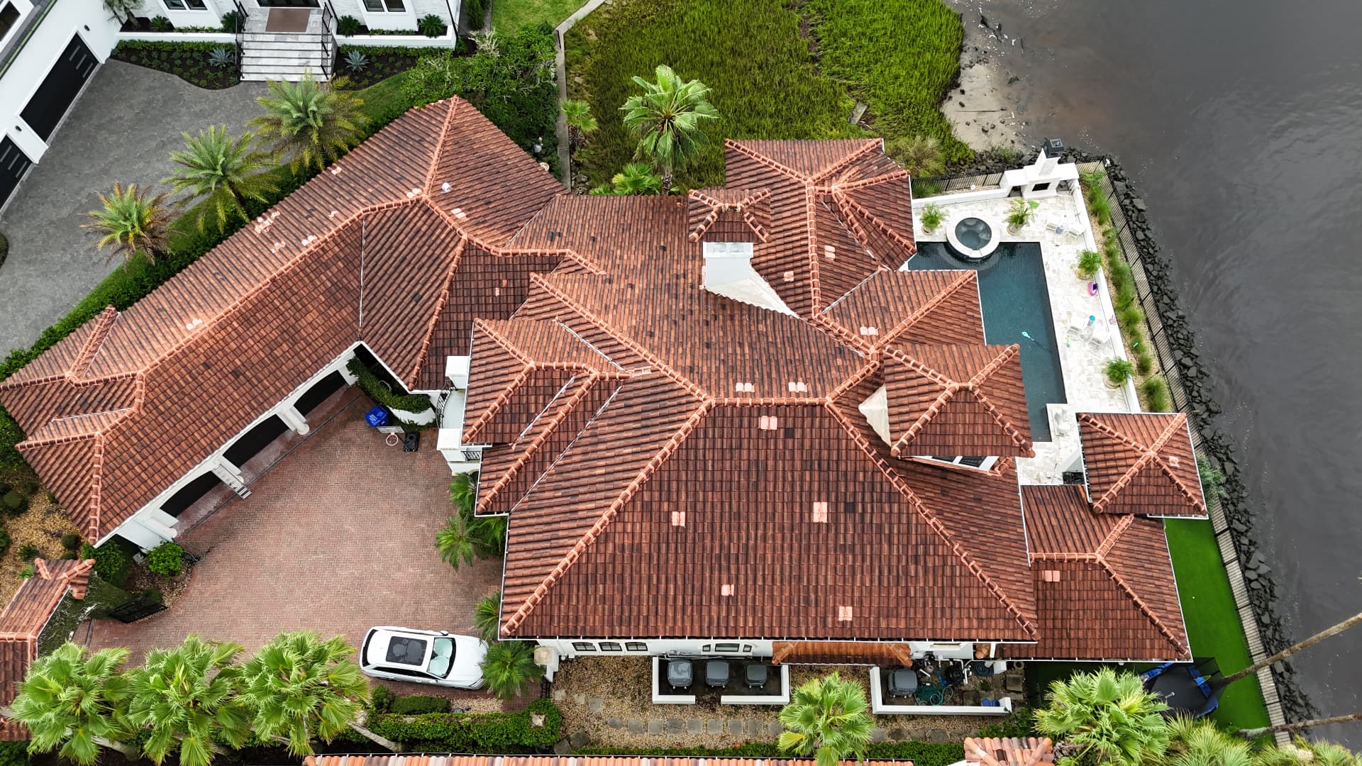 Aerial view of a tile roof before professional cleaning