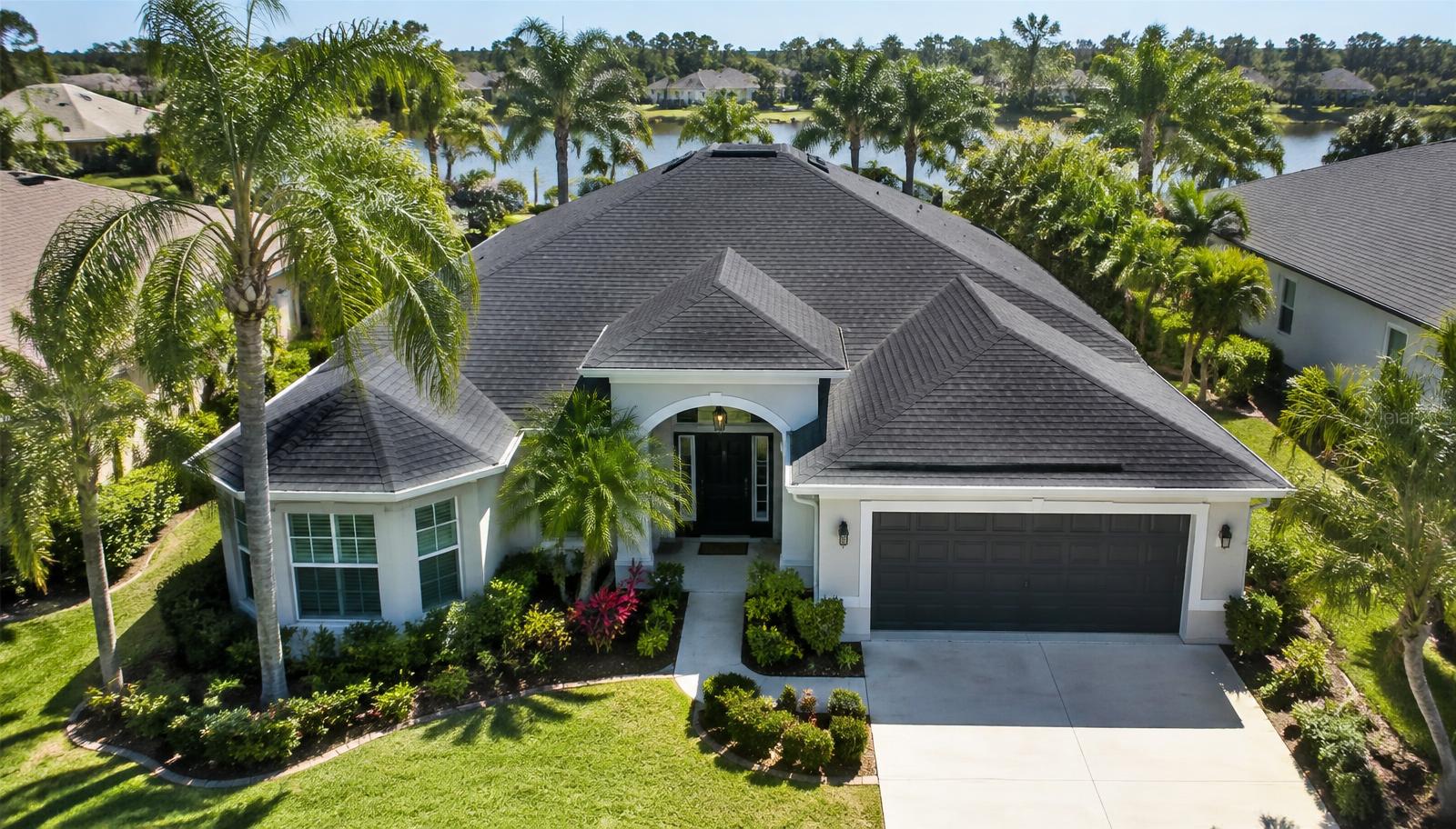 Aerial view of a Florida home with a clean shingle roof